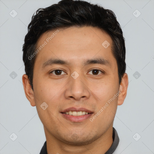 Joyful asian young-adult male with short  brown hair and brown eyes