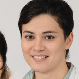 Joyful white young-adult female with medium  brown hair and brown eyes