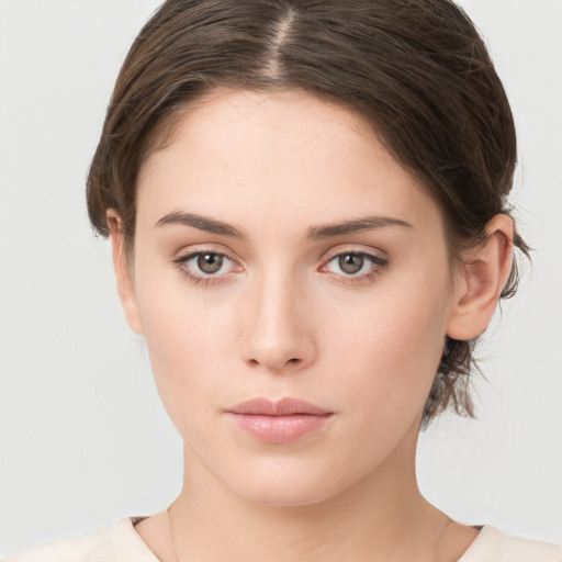 Neutral white young-adult female with medium  brown hair and brown eyes