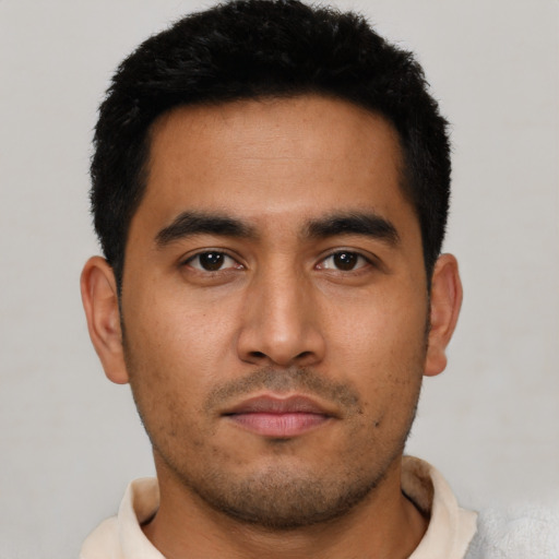 Neutral latino young-adult male with short  black hair and brown eyes