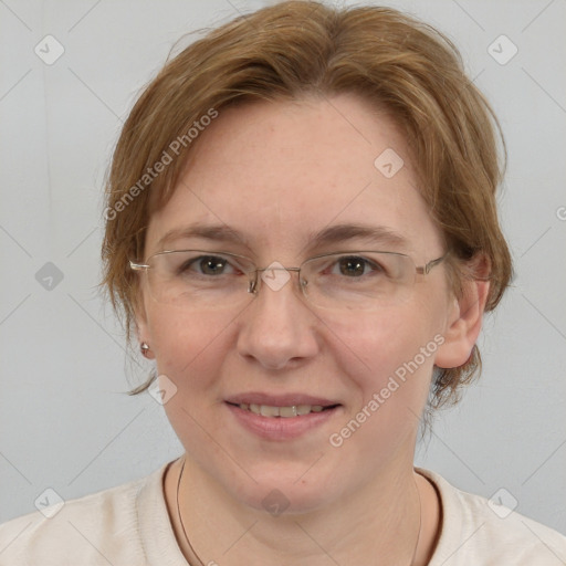 Joyful white adult female with medium  brown hair and blue eyes