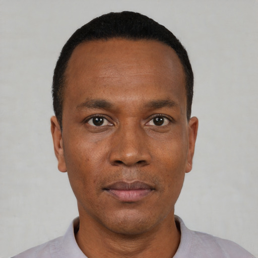 Neutral black adult male with short  black hair and brown eyes
