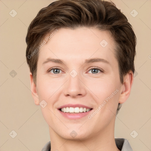 Joyful white young-adult female with short  brown hair and grey eyes