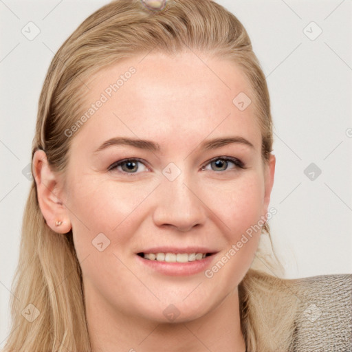 Joyful white young-adult female with long  brown hair and blue eyes