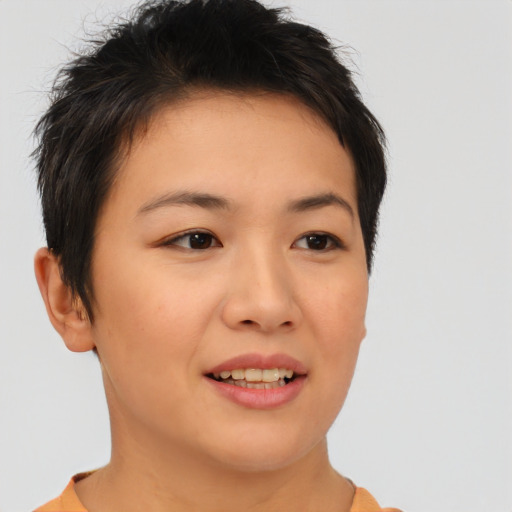 Joyful asian young-adult female with short  brown hair and brown eyes