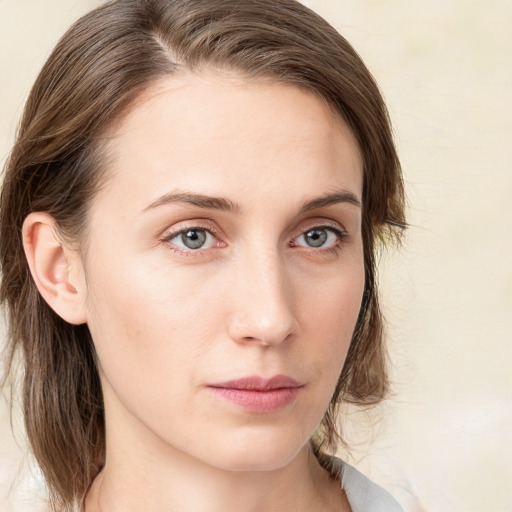 Neutral white young-adult female with medium  brown hair and green eyes