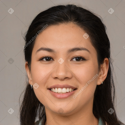 Joyful asian young-adult female with long  brown hair and brown eyes