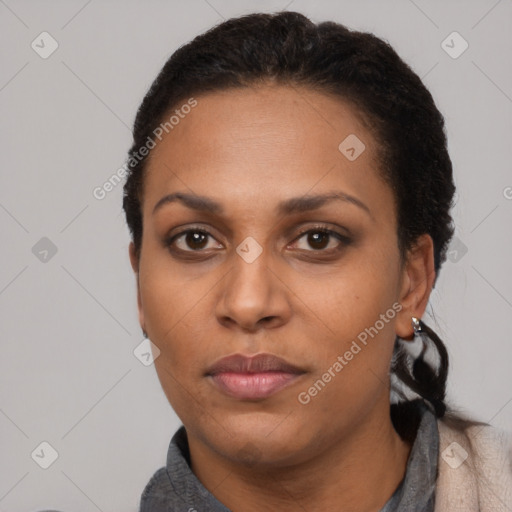 Neutral black adult female with short  black hair and brown eyes