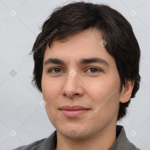 Joyful white young-adult male with medium  brown hair and brown eyes