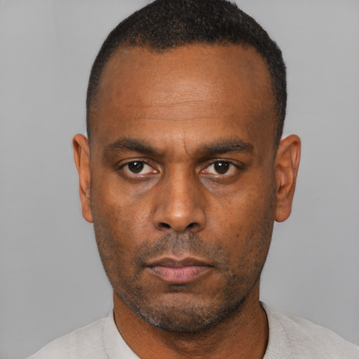 Neutral black adult male with short  black hair and brown eyes