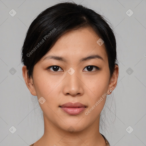 Joyful asian young-adult female with medium  black hair and brown eyes