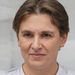 Joyful white adult female with short  brown hair and brown eyes