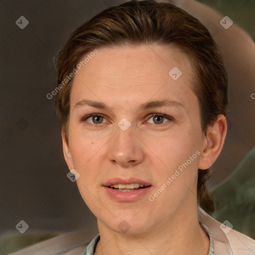 Joyful white adult female with short  brown hair and grey eyes