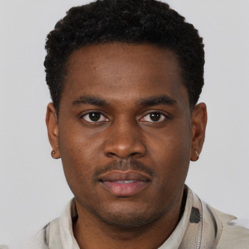 Neutral latino young-adult male with short  brown hair and brown eyes