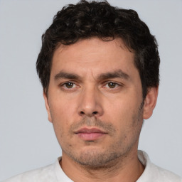 Neutral white young-adult male with short  black hair and brown eyes