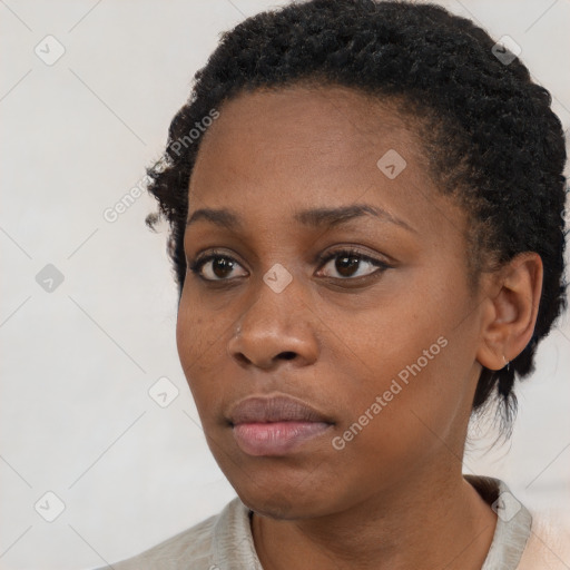 Neutral black young-adult female with short  black hair and brown eyes