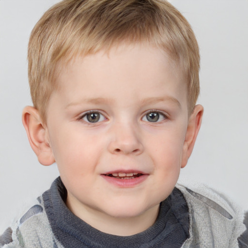 Joyful white child male with short  brown hair and grey eyes