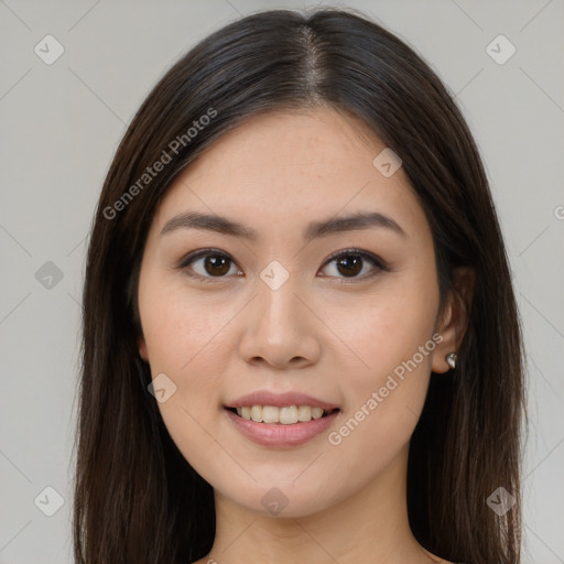 Joyful asian young-adult female with long  brown hair and brown eyes