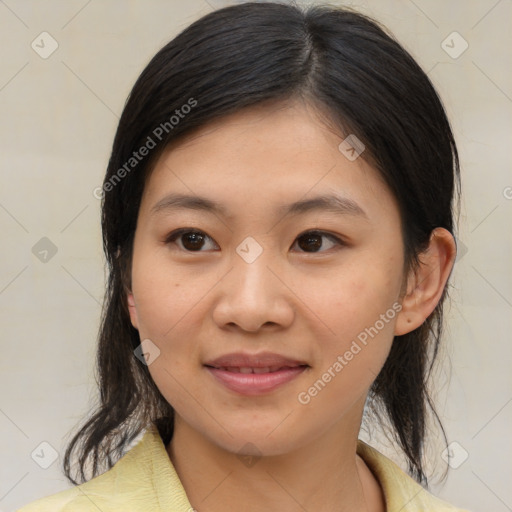 Joyful asian young-adult female with medium  brown hair and brown eyes