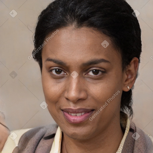 Joyful latino young-adult female with short  brown hair and brown eyes