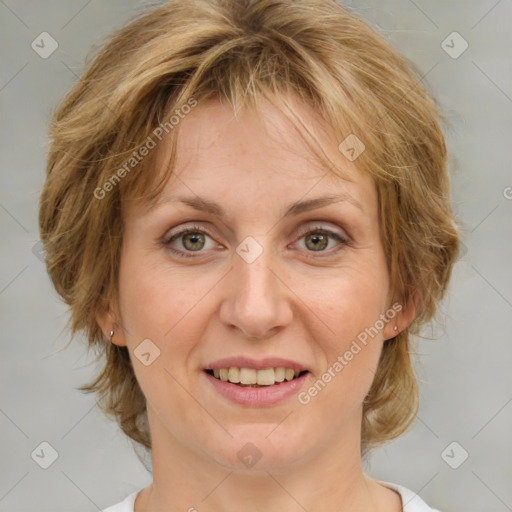 Joyful white adult female with medium  brown hair and green eyes