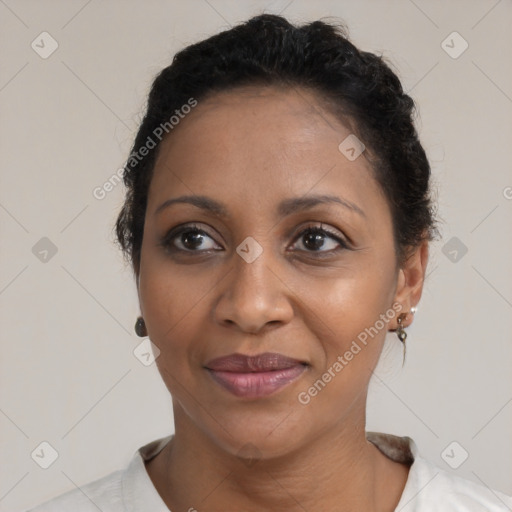 Joyful black adult female with short  brown hair and brown eyes