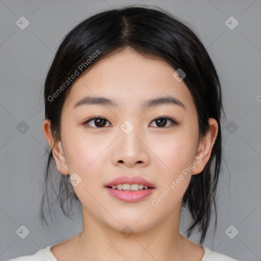 Joyful asian young-adult female with medium  black hair and brown eyes