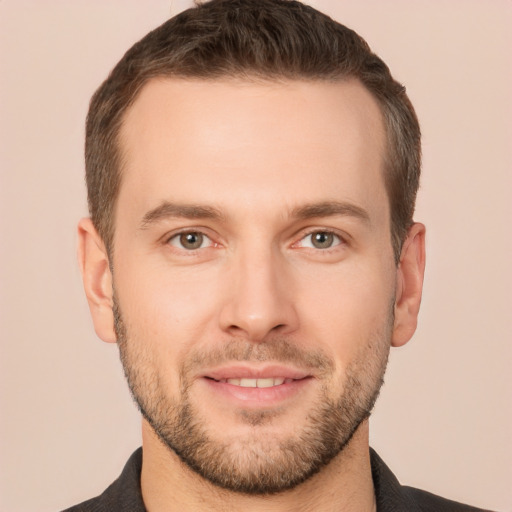 Joyful white young-adult male with short  brown hair and brown eyes