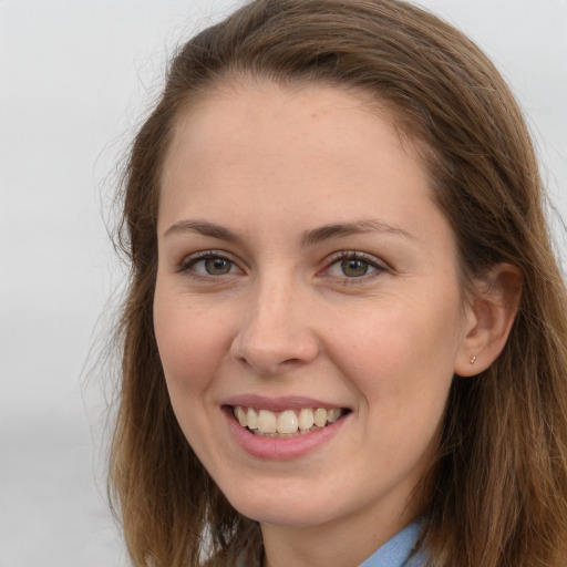 Joyful white young-adult female with long  brown hair and grey eyes