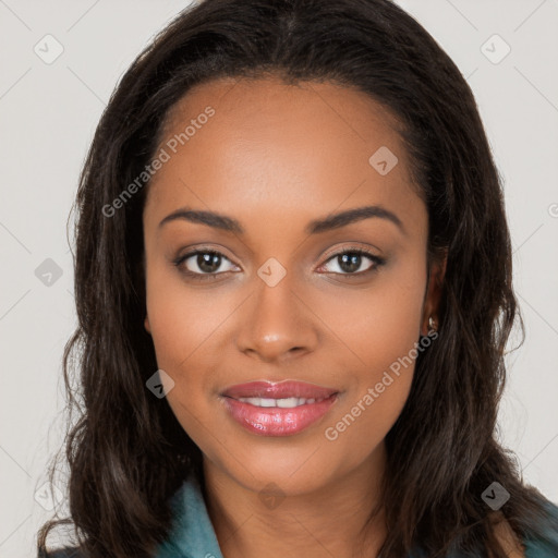 Joyful black young-adult female with long  brown hair and brown eyes