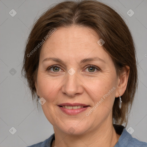 Joyful white adult female with medium  brown hair and grey eyes