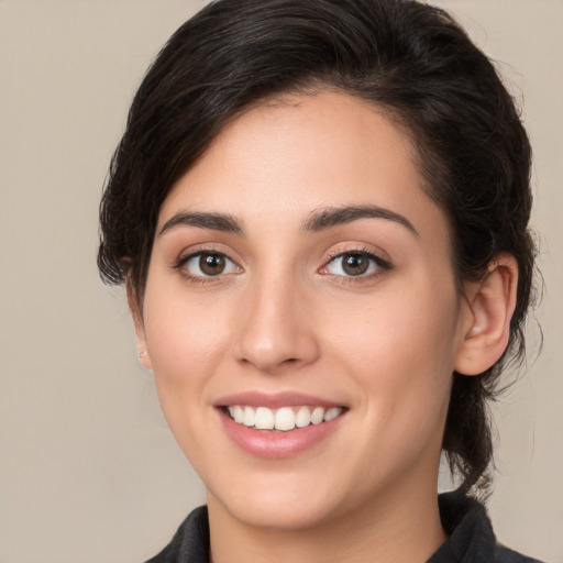 Joyful white young-adult female with medium  brown hair and brown eyes