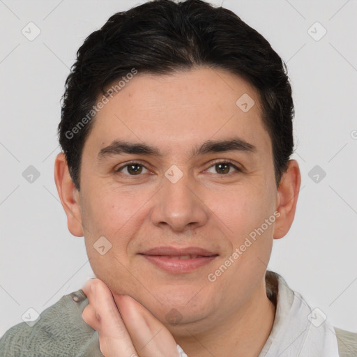 Joyful white adult male with short  brown hair and brown eyes