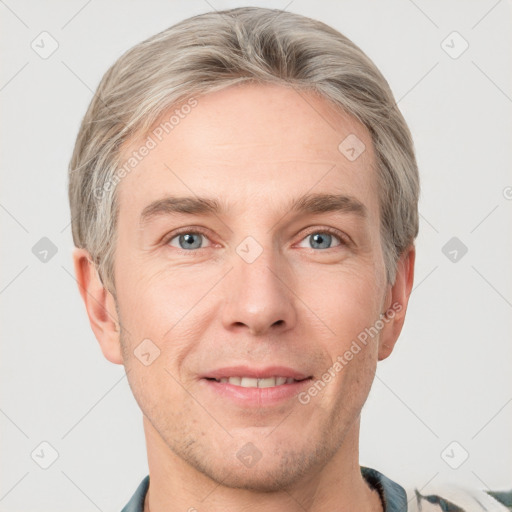 Joyful white adult male with short  brown hair and grey eyes