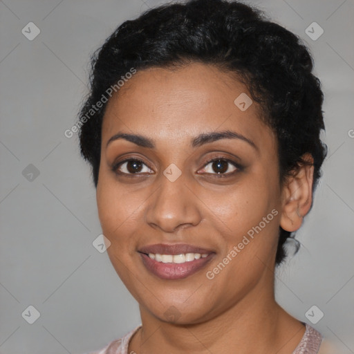 Joyful latino young-adult female with short  black hair and brown eyes