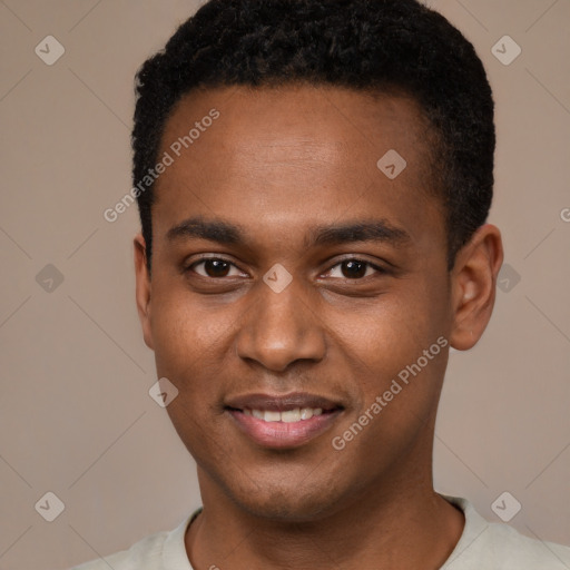 Joyful black young-adult male with short  black hair and brown eyes