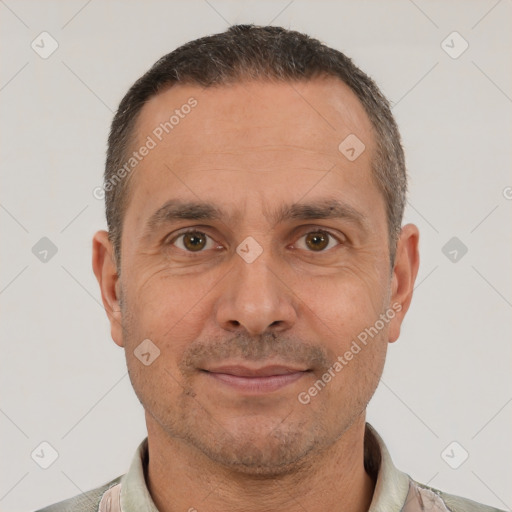 Joyful white adult male with short  brown hair and brown eyes