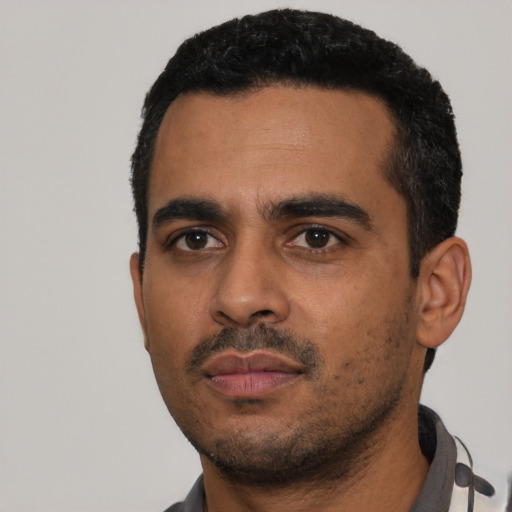 Neutral latino young-adult male with short  black hair and brown eyes