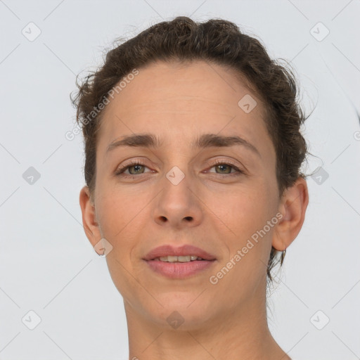 Joyful white adult female with short  brown hair and brown eyes