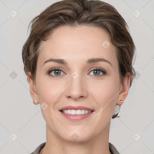 Joyful white young-adult female with short  brown hair and grey eyes