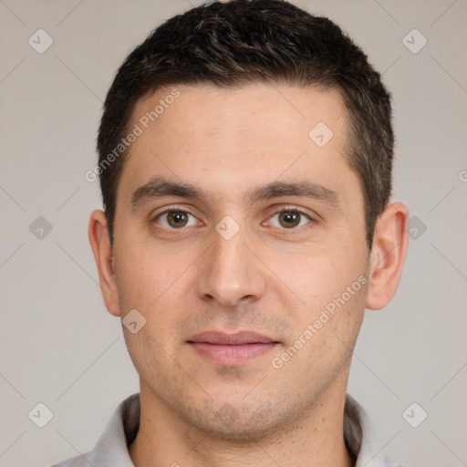 Joyful white young-adult male with short  brown hair and brown eyes