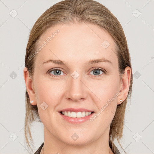 Joyful white young-adult female with long  brown hair and blue eyes