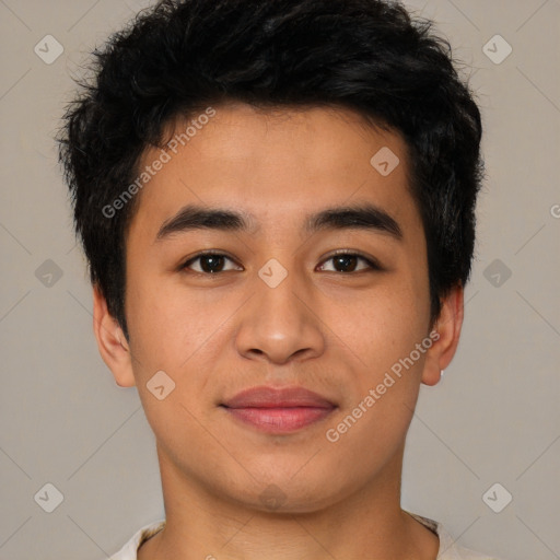 Joyful asian young-adult male with short  black hair and brown eyes