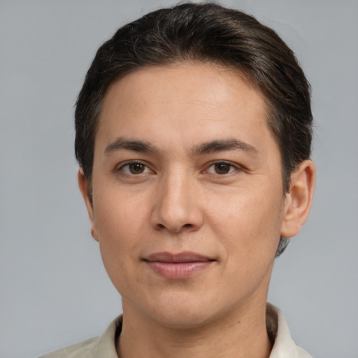 Joyful white adult male with short  brown hair and brown eyes