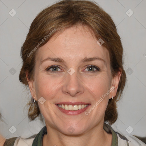 Joyful white adult female with medium  brown hair and brown eyes