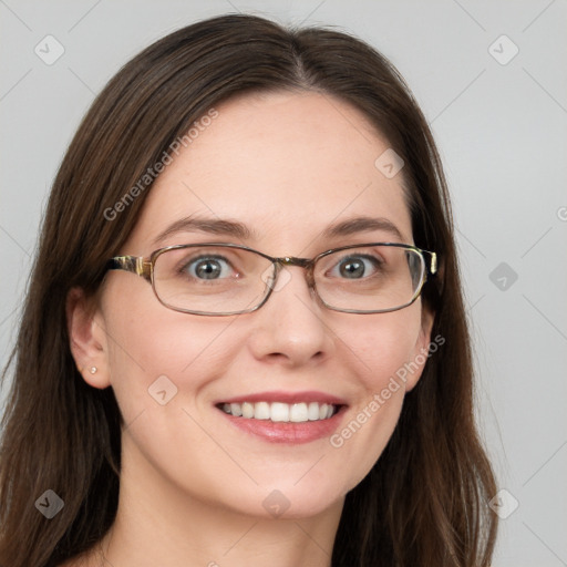 Joyful white young-adult female with long  brown hair and blue eyes