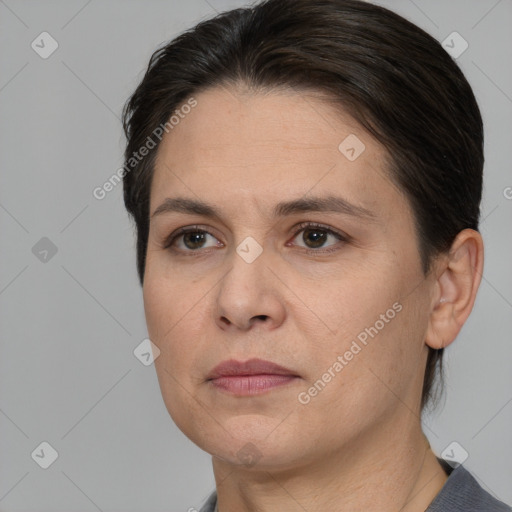 Joyful white adult female with short  brown hair and brown eyes