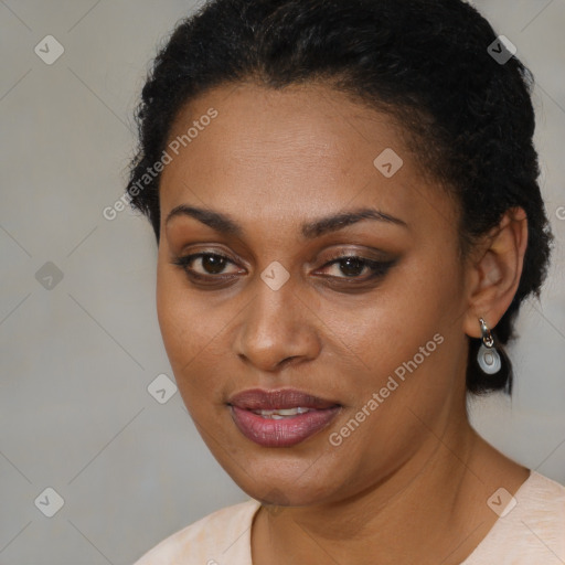 Joyful black young-adult female with short  brown hair and brown eyes