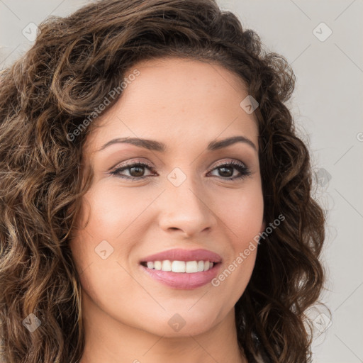 Joyful white young-adult female with long  brown hair and green eyes