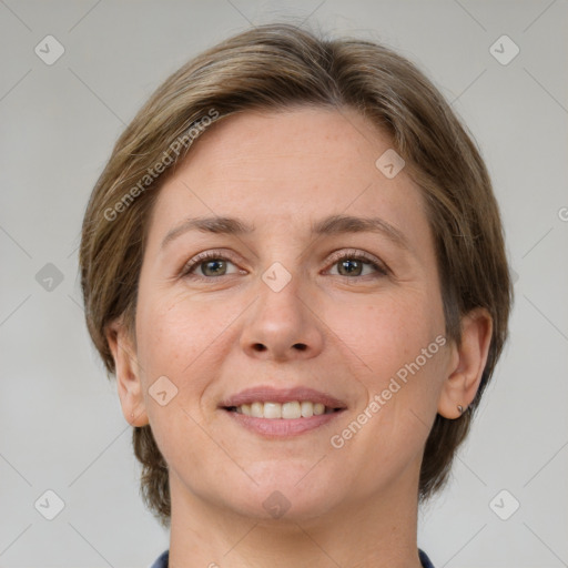 Joyful white adult female with medium  brown hair and grey eyes